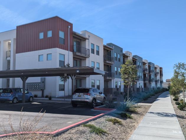 Landscaped pathway between buildings at Encanto at Mesa del Sol